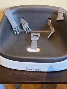 Portable White and Charcoal Gray Booster Seat for Toddler by Ingenuity.